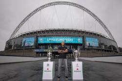 henry with euro and ucl trophy with wembley arch backdrop 2 676x451